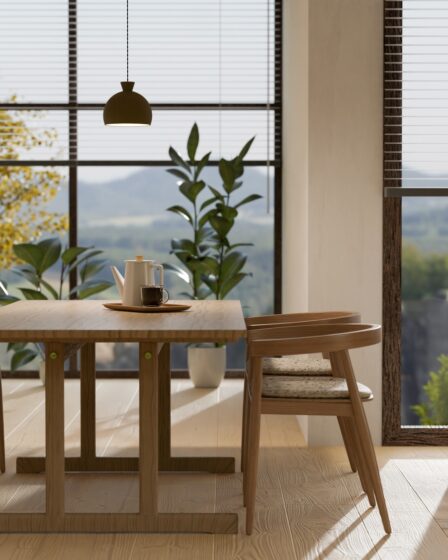 Minimal wood dining table set with sofa, home decor and amazing glass window in background.
